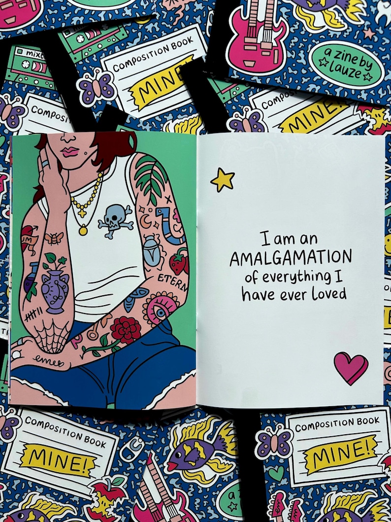 May include: Open composition book with a colorful illustration. The left page features a person with tattoos, wearing a white tank top and blue shorts. The right page has the text "I am an AMALGAMATION of everything I have ever loved."