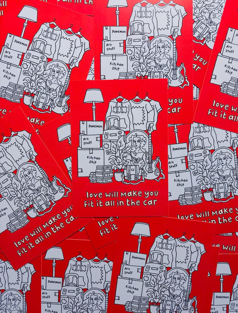 May include: Red cards featuring a black and white illustration of moving boxes, clothes, a guitar, and a woman. The text on the cards reads "love will make you fit it all in the car."