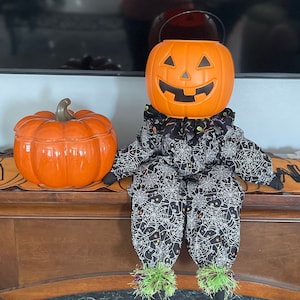Halloween Pumpkin Man Doll: Spiderweb Decor with Candy Bucket Head