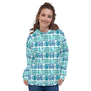 May include: A white hoodie with a blue and green geometric pattern. The hoodie has a drawstring hood and a kangaroo pocket.
