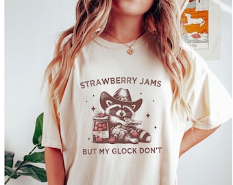 Strawberry Jams But My Glock Dont Comfort Colors Cowboy Raccoon Shirt, Vintage Raccoon T Shirt, Raccoon Lover Gift, Weirdcore Meme Clothing