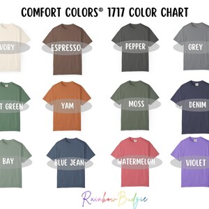 May include: A color chart displaying Comfort Colors 1717 t-shirts in various shades. Colors include Ivory, Espresso, Pepper, Grey, Light Green, Yam, Moss, Denim, Bay, Blue Jean, Watermelon, and Violet. The text "COMFORT COLORS&reg; 1717 COLOR CHART" is at the top.