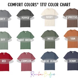 May include: A colour chart showcasing Comfort Colors 1717 t-shirts in a range of hues. The chart includes colours such as grey, pepper, ivory, espresso, bay, light green, moss, yam, red, crimson, blue jean, and denim. The text "COMFORT COLORS&reg; 1717 COLOR CHART" is at the top.