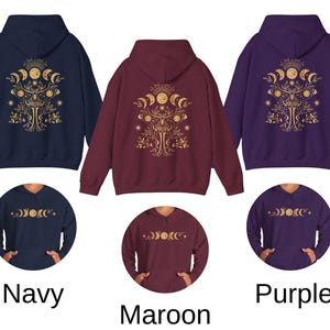 May include: Navy, maroon, and purple hoodies with a gold celestial design on the back. The design includes crescent moons, stars, and a tree-like structure. The word "Navy", "Maroon", and "Purple" are printed below each hoodie.