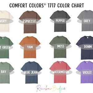 May include: A color chart of Comfort Colors 1717 t-shirts, showcasing various hues. Colors include Ivory, Espresso, Pepper, Grey, Light Green, Yam, Moss, Denim, Bay, Blue Jean, Watermelon, and Violet. The text "COMFORT COLORS&reg; 1717 COLOR CHART" is at the top.