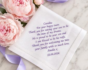 May include: A white square handkerchief with embroidered purple text that reads: Caroline, For your happy tears, Thank you for raising your son to be the man of my dreams. He is proud to be your son and I am blessed to be his wife. Thank you for welcoming me into your family with so much love, Amelia x, 22.06.2024.