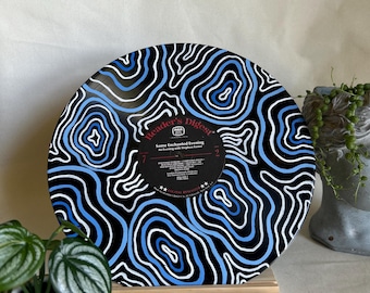 May include: A black vinyl record with a blue and white abstract design. The record is titled "Reader's Digest" and features the song "Some Enchanted Evening".