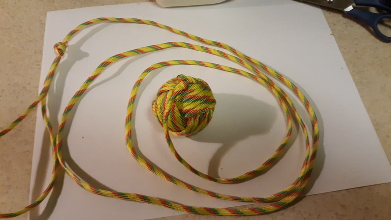 parasoccer footbag game on a string paracord toy image 0