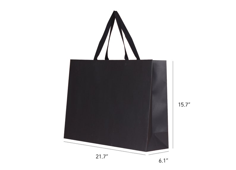 May include: A black shopping bag with a rectangular shape and a pair of black handles. The bag is 21.7 inches long, 15.7 inches high, and 6.1 inches wide. The bag is made of a matte material.