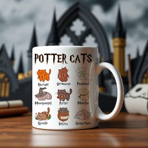 May include: White ceramic mug featuring a black and brown illustration of cats with Harry Potter character names. The mug reads "Potter Cats" at the top.