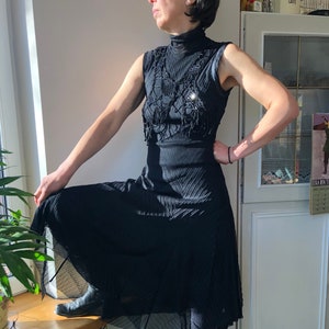 Vintage black turtle neck sleeveless party dress decorated with sequences and beeds. S-M size.