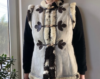Vintage sheepskin waistcoat. Boho, hippie women’s embellished shearling vest. S size