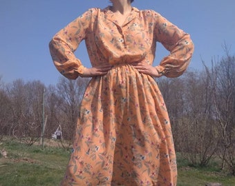 Vintage 70s does 40s puff sleeve apricot dress with floral print.