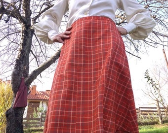 Vintage 70s tartan flared skirt. High waisted red plaid below the knee skirt.