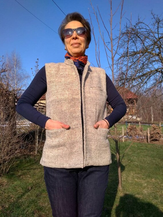 grey sleeveless jacket