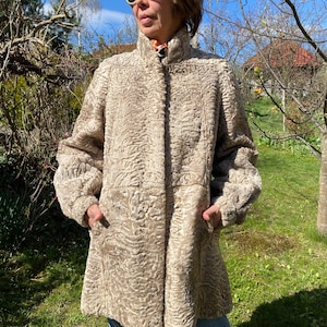 Vintage 70s beige Astrakhan fur coat. Reversible coat M size.