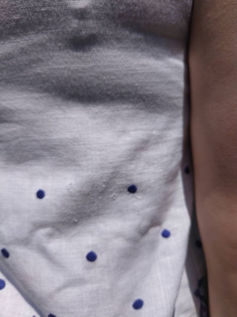 Vintage 60/'s white cotton sleeveless top with blue floral embroidery.