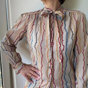 Vintage 70-80ss tan brown striped long sleeve blouse with tie-bow neckline. S-M size women’s blouse.