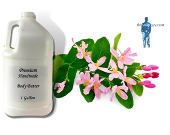 May include: A white plastic gallon jug of premium handmade body butter. The jug has a black label with the text "Premium Handmade Body Butter 1 Gallon".