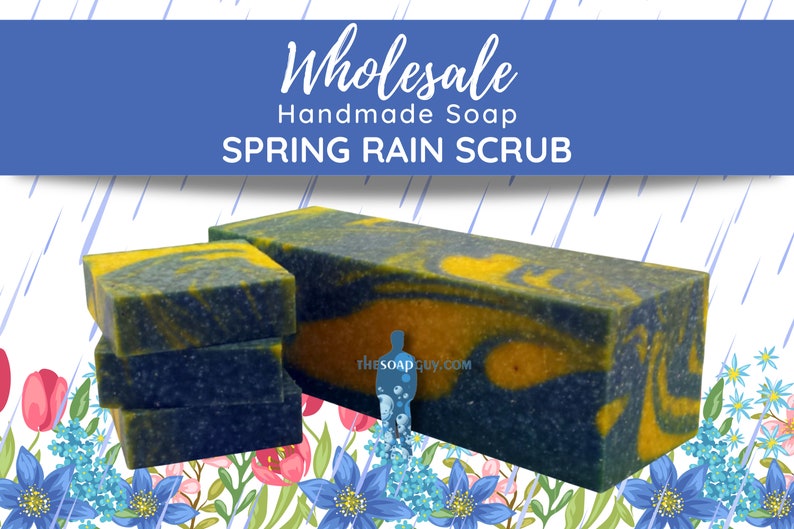May include: Wholesale handmade soap bars in a blue and yellow swirl pattern with a spring rain scrub scent. The soap bars are stacked on top of each other and are sitting on a floral background.