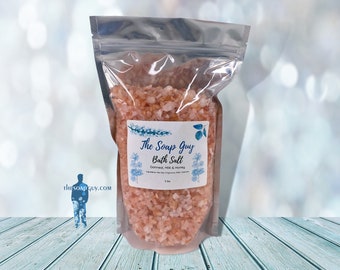 May include: A clear plastic bag filled with pink Himalayan bath salt. The bag has a label that reads "The Soap Guy Bath Salt Oatmeal, Milk & Honey".