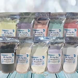 May include: Ten clear plastic bags with silver zippers, each containing a different colored mineral powder. The bags are labeled "The Soap Guy Mineral Powder".