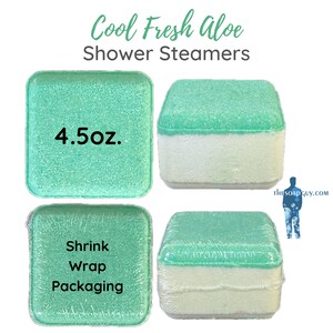 May include: Four shower steamers in shrink wrap packaging. Each steamer is a square, with a green top and a white bottom. The steamers are labeled "Cool Fresh Aloe Shower Steamers" and "4.5 oz."