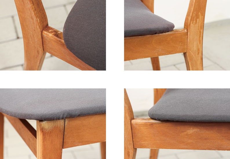 K&ouml;nnte beinhalten: Nahaufnahme eines Holzstuhls mit einem dunkelgrauen Stoffbezug. Der Stuhl hat ein schlichtes Design mit einer leicht geschwungenen R&uuml;ckenlehne und geraden Beinen. Der Stoffbezug ist glatt und wirkt abgenutzt.