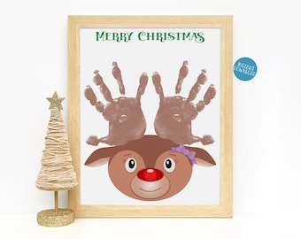 May include: Printable Christmas reindeer craft with the words "Merry Christmas" at the top. The reindeer is made with handprints for antlers and has a red nose and a pink bow.