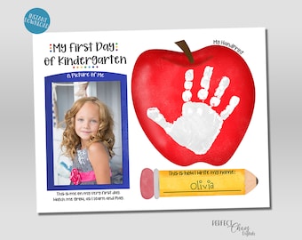 May include: A printable first day of kindergarten sign with a red apple, a handprint, a picture frame, and a pencil. The text on the sign reads "My First Day of Kindergarten", "A Picture of Me", "This is me on my very first day. Watch me grow, as I learn and play.", "My Handprint", "This is how I write my name:", and "Olivia".