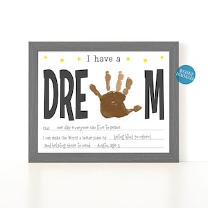 May include: A printable art print with a handprint in the center of the word "DREAM". The print includes the text "I have a dream that one day everyone can live in peace. I can make the world a better place by being kind to others and helping those in need - Austin, age 5."