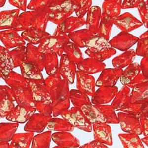 May include: Red glass beads with gold flecks. The beads are shaped like a teardrop with a pointed end.