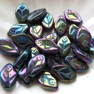 May include: A collection of iridescent leaf-shaped beads. The beads have a glossy finish with a color-shifting effect, displaying hues of blue, purple, and green. Each bead features a detailed leaf vein design and small holes for stringing.