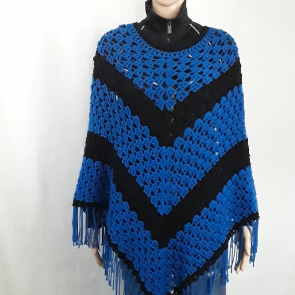 Blue and black poncho handmade by Celebrated Crochet. One size fits most ladies & plus size women.