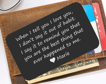 May include: A black metal wallet card with a handwritten message that reads "When I tell you I love you, I don't say it out of habit. I say it to remind you that you are the best thing that ever happened to me. Marie". The card is in a brown leather wallet.