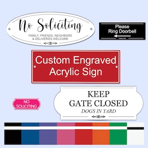 May include: A set of six engraved signs with various messages, including "No Soliciting", "Please Ring Doorbell", "Keep Gate Closed Dogs in Yard", and "Custom Engraved Acrylic Sign". The signs are in different colours and styles, including white, red, black, and green.