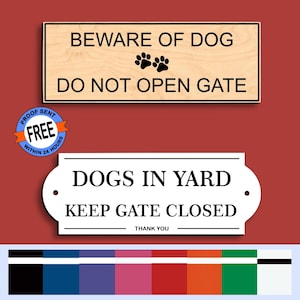May include: Two signs with text on a red background. The top sign is rectangular, light wood with black text: "BEWARE OF DOG DO NOT OPEN GATE" and paw prints. The bottom sign is white with black text: "DOGS IN YARD KEEP GATE CLOSED".