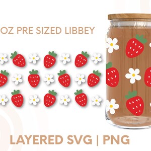 May include: A 16 oz pre-sized Libbey glass jar with a brown background and a repeating pattern of red strawberries and white flowers. The text "16 OZ PRE SIZED LIBBEY" is at the top of the image. The text "LAYERED SVG | PNG" is at the bottom of the image.
