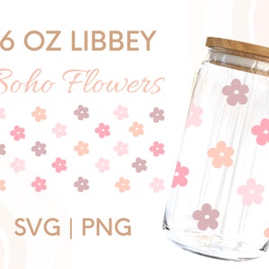 May include: A 16 oz. glass jar with a wooden lid, decorated with a pattern of pink, peach, and purple flowers. The jar is labeled "16 oz. LIBBEY Boho Flowers SVG | PNG".
