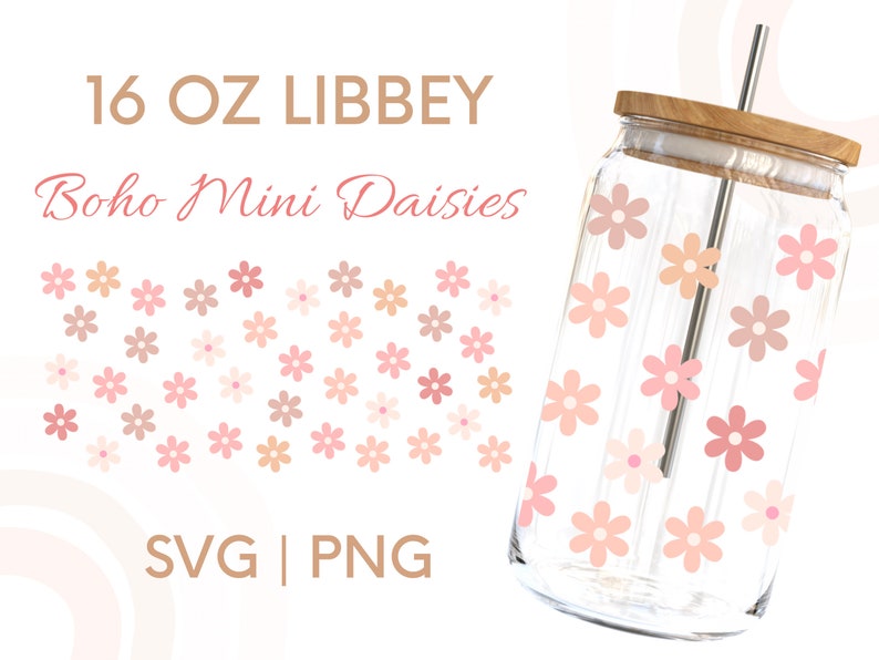 May include: A 16 oz. glass jar with a wooden lid and a straw. The jar is decorated with a pattern of pink and peach daisies. The text "16 OZ LIBBEY Boho Mini Daisies SVG | PNG" is printed on a white background.