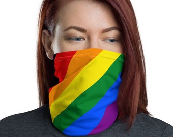 May include: A person wearing a face covering with a rainbow design. The face covering is made of a soft, breathable fabric and is comfortable to wear.