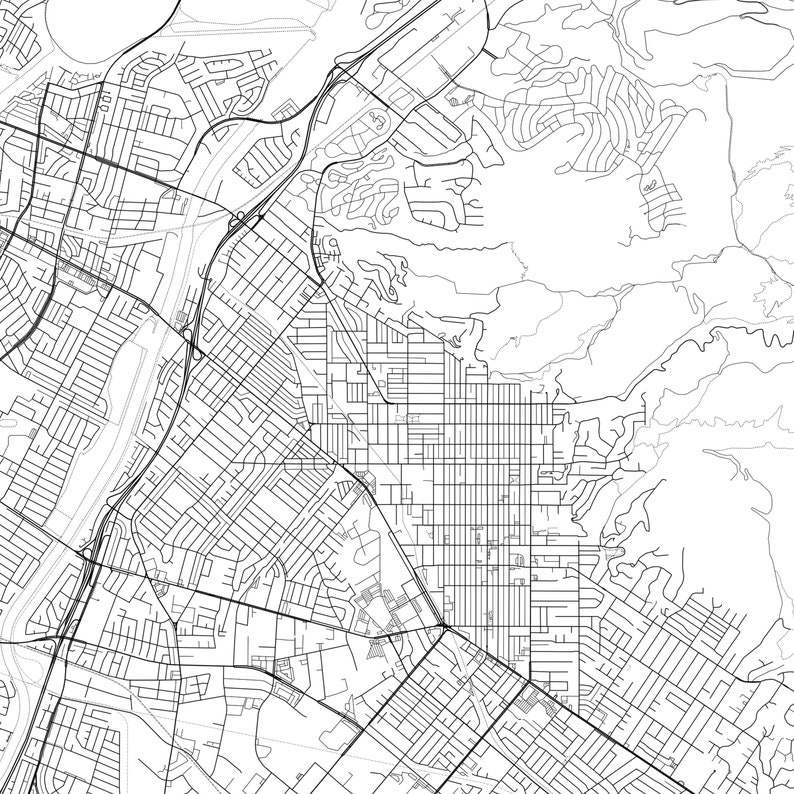 May include: A black and white aerial map of a city with a grid-like street layout. The map shows a network of roads, streets, and highways.
