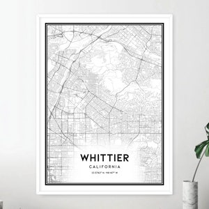 May include: Black and white map print of Whittier, California. The map shows the city streets and surrounding areas. The text "WHITTIER, CALIFORNIA 33.9742&deg; N, 118.0427&deg; W" is printed at the bottom of the map.