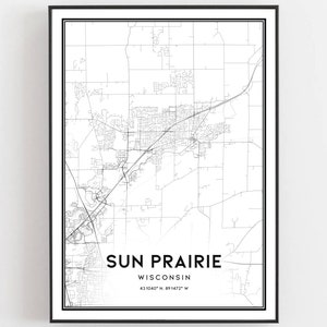 May include: Black and white map print of Sun Prairie, Wisconsin. The map shows the city's streets and roads. The text "Sun Prairie, Wisconsin 43.1040° N 89.1472° W" is printed below the map.