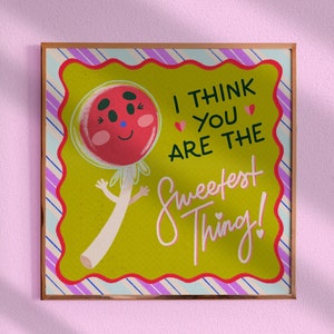 May include: A framed illustration of a cartoon lollipop with a smiling face and the text "I think you are the sweetest thing!"