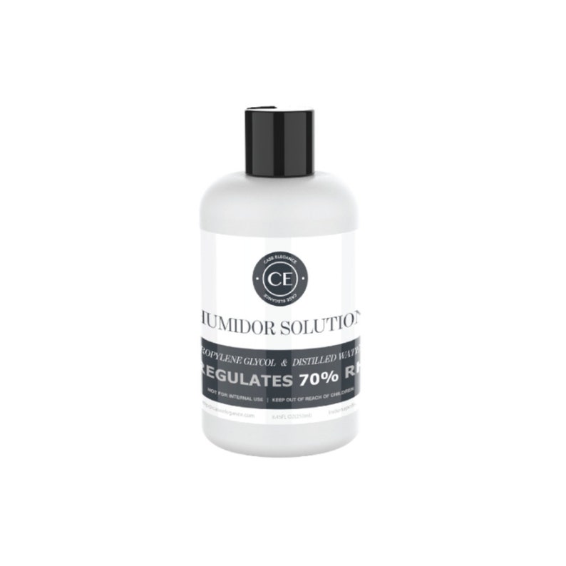 May include: A white plastic bottle with a black lid and label. The label reads "Humidor Solution", "Propylene Glycol & Distilled Water", "Regulates 70% RH", and "C.E. Cigar Elegance Experts Since 2007".