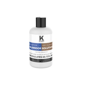 May include: A white plastic bottle with a black cap labeled "KLARO Cigar Accessories" and "WINTER + DRY CLIMATE HUMIDOR SOLUTION". The bottle also says "EXTRA STRENGTH" and "PROPYLENE GLYCOL & DISTILLED WATER REGULATES 65-72% RH".