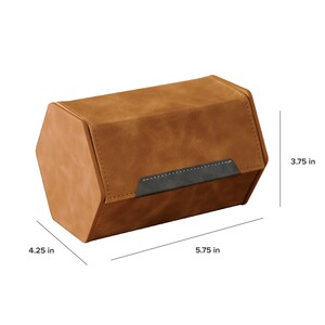 May include: A brown faux leather dice rolling tray with a black leather flap and white stitching. The tray is 5.75 inches long, 4.25 inches wide, and 3.75 inches high.