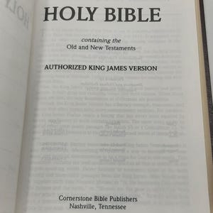May include: Open book displaying the title "HOLY BIBLE" in large, bold letters. The text reads "Authorized King James Version" and includes the Old and New Testaments. Published by Cornerstone Bible Publishers, Nashville, Tennessee.