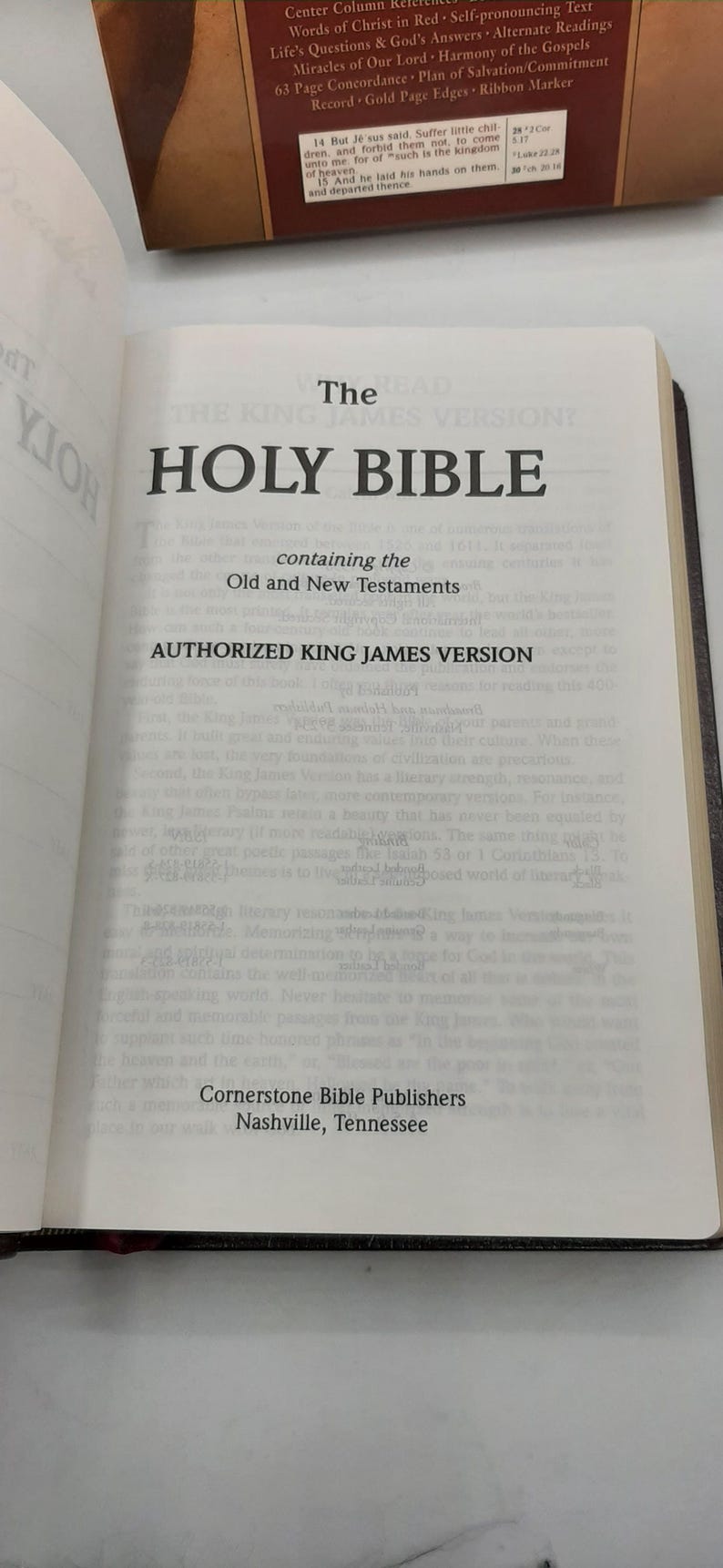May include: Open book displaying the title "HOLY BIBLE" in large, bold letters. The text reads "Authorized King James Version" and includes the Old and New Testaments. Published by Cornerstone Bible Publishers, Nashville, Tennessee.